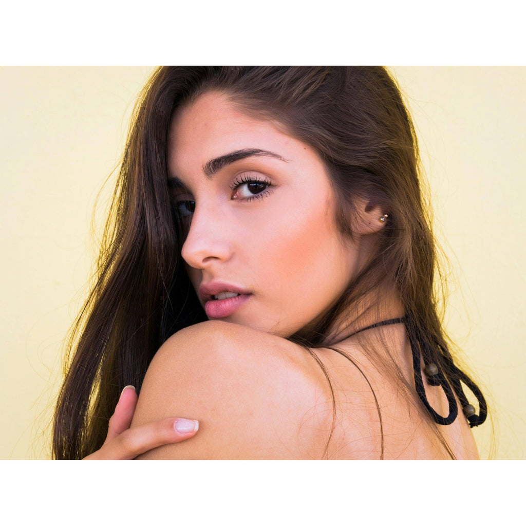 Woman with dewy, youthful-looking skin